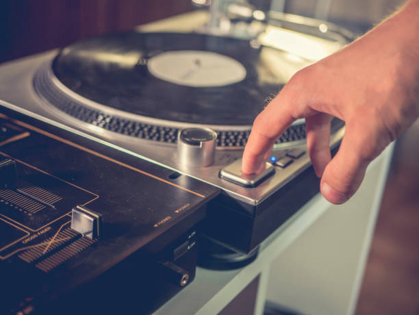 istock close up hand push start play button on a vintage vinyl records turntable gramophone player 1014578704