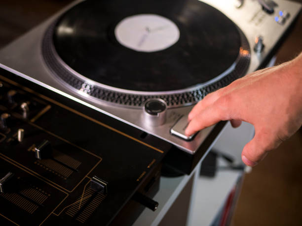 istock close up hand push start play button on a vintage vinyl records turntable gramophone player 1014578742