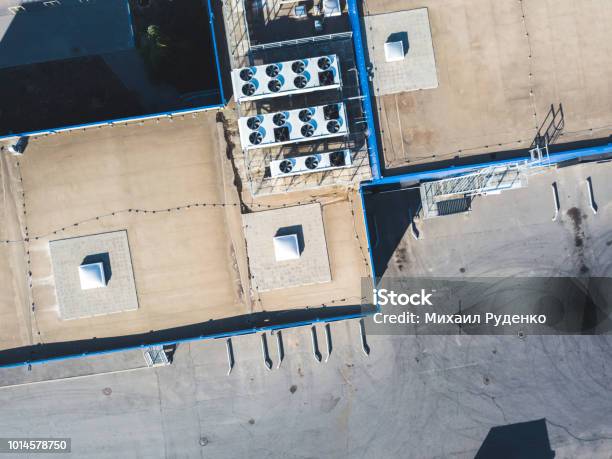 Aerial Top View Of Industrial Technical System Machines On The Rooftop Of Hangar Building Stock Photo - Download Image Now