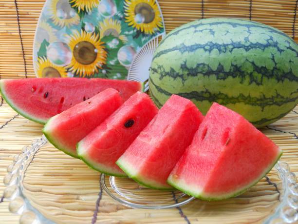 istock Watermelon and round hand fan 1014582362