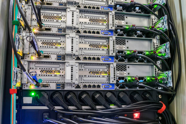 istock Back of the powerful computer servers installed in the rack. Electrical sockets and network interfaces are  close-up. The computing equipment is  in the server room of the data center 1014595702