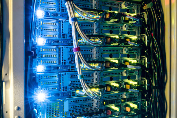 istock Computer technology works in a dark server room of the data center. Bright indication on network interfaces. Equipment for mining of crypto currency 1014595706