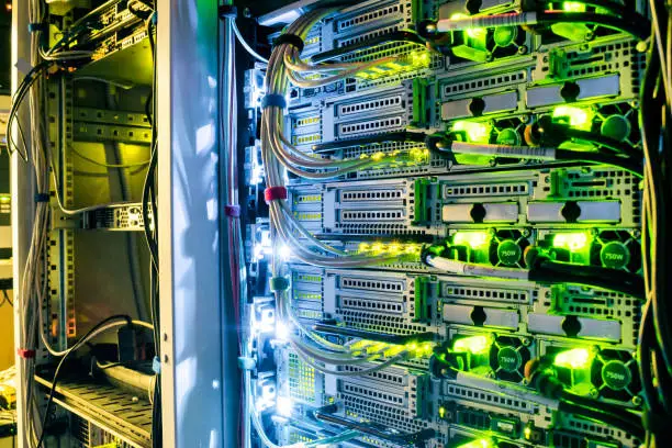 Network routers of ISP. Many wires connect to the network interfaces of powerful Internet servers. Racks with computer equipment in the server room datacenter