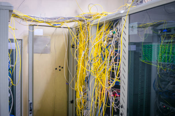 istock Messy internet wires have a connection to computer servers. Cabinets with computer equipment are located in the data center. Racks with servers are located in the server room 1014595868