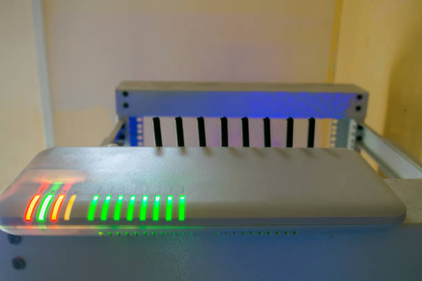 istock Wi-fi router. A multi-channel gsm gateway with several antennas is installed in the server room. Technical solution for office IP telephony. 1014595922