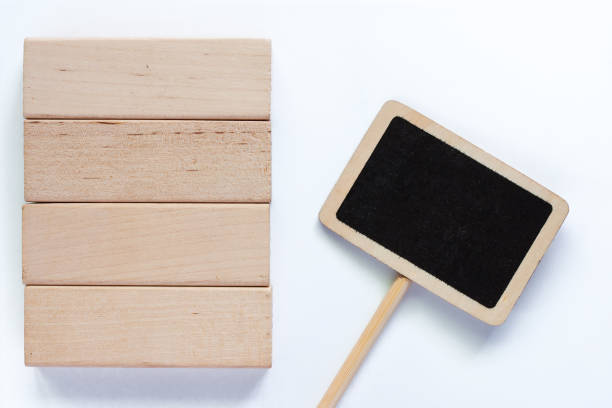 istock Wooden block toy with blackboard label stick on white background 1014608926