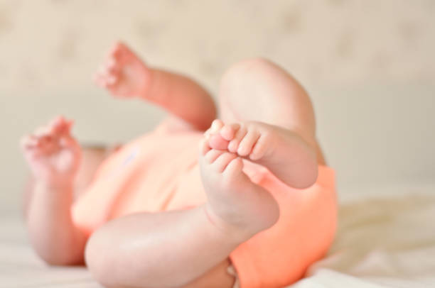 istock Baby boy cute feet diaper 1014613680