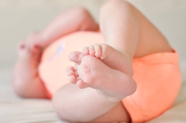 istock Baby boy cute feet diaper 1014613714