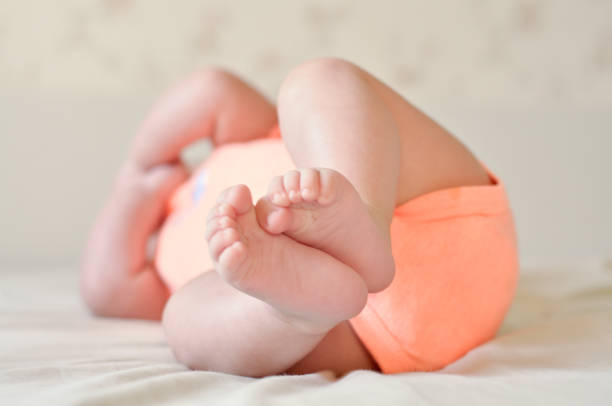 istock Baby boy cute feet diaper 1014613740