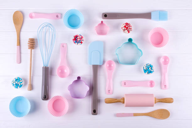 istock Baking and cooking concept. Pattern made of cookie cutters, whisk, roller pin and kitchen bake tools for making sweets. White  background. Top view of a holiday baking still life 1014613928