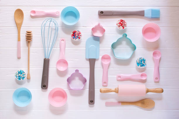 istock Baking and cooking concept. Pattern made of cookie cutters, whisk, roller pin and kitchen bake tools for making sweets. White  background. Top view of a holiday baking still life 1014613934