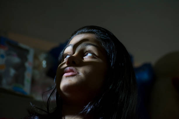istock hand shadows on cute girl 1014640920