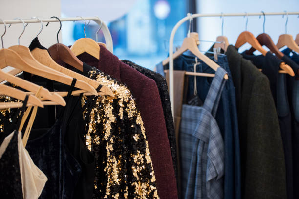 istock shopping concept - women clothes on hangers 1014643152