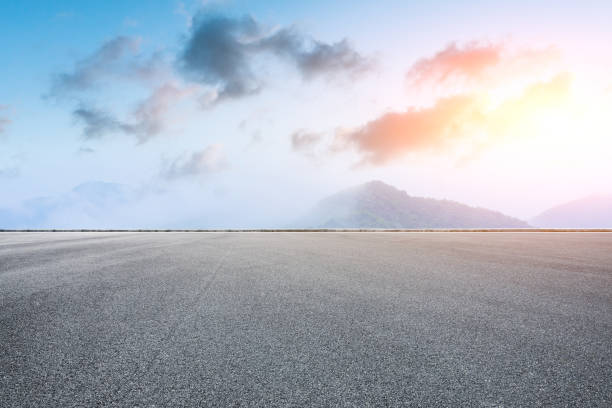 istock Asphalt square and mountain scenery at sunrise 1014645264