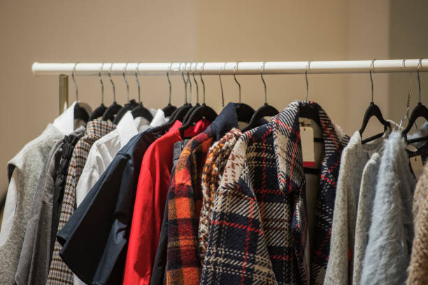 istock shopping concept - women clothes on hangers 1014645640