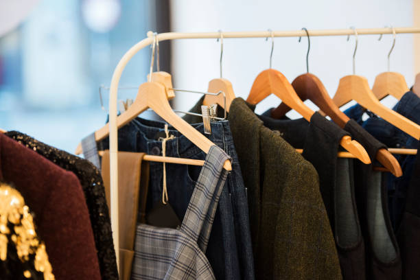 istock shopping concept - women clothes on hangers 1014645656