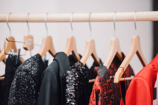 istock shopping concept - women clothes on hangers 1014645762