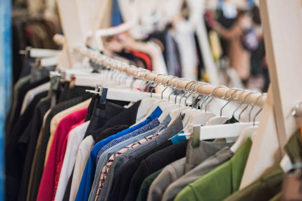 istock shopping concept - women clothes on hangers 1014645836