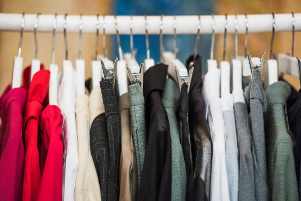 istock shopping concept - women clothes on hangers 1014645928