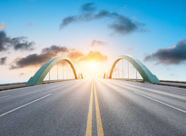 istock Asphalt road and beautiful sky clouds at sunrise 1014651620