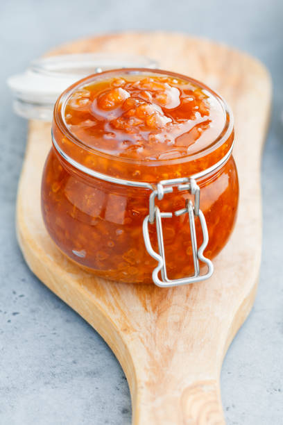 istock Glass jar with cloudberry jam. Nordic cuisine. 1014655220