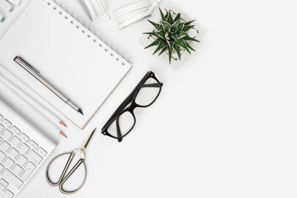 Above view of office supplies with copy space on white