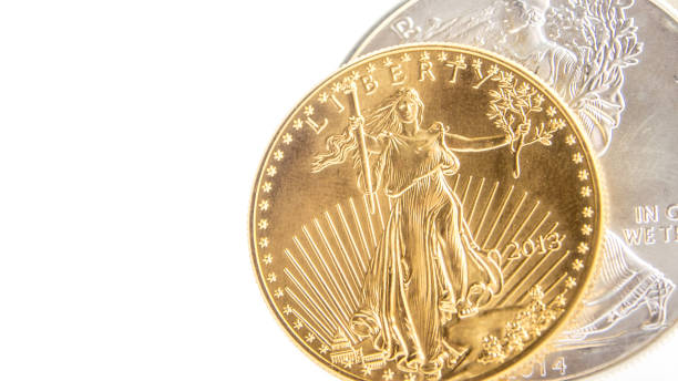 istock silver eagle and golden american eagle one ounce coins 1014658808