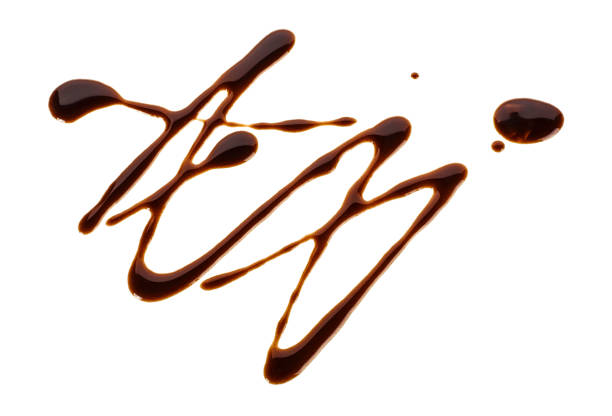 istock Sweet chocolate sauce isolated on a white background 1014658896