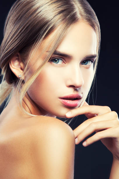 istock Young woman beauty posing at camera 1014661378