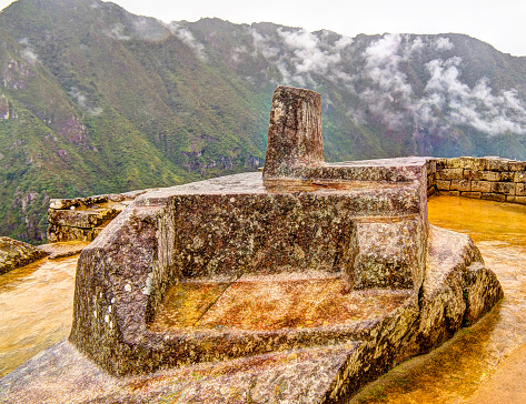 Intihuatana stone as an astronomic clock or calendar by the Incas in Machu Picchu archaeological site with Polygonal masonry at  Cuzco, Peru