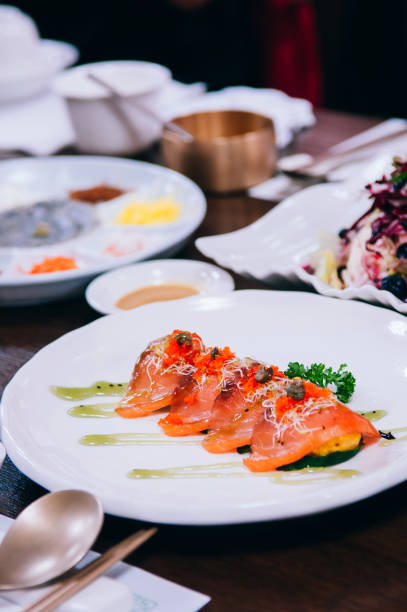 istock Korean style Salmon sashimi in white plate with roe 1014662130