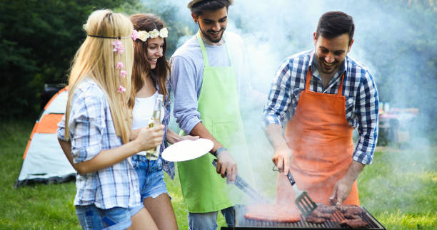 istock Happy people having camping and having bbq party 1014667602