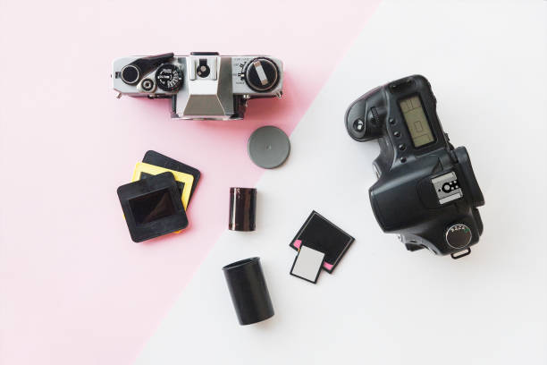 istock Digital vs. Analog SLR Camera with Slides, Memory Cards, 35 mm Film 1014668528
