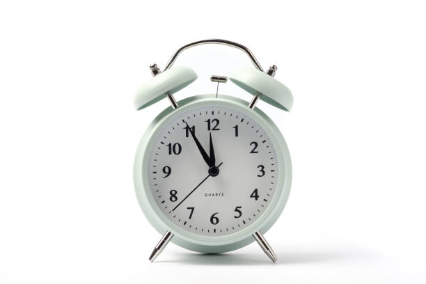 istock pastel retro alarm clock or vintage alarm clock isolated on white background 1014668612