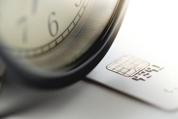 istock Close-up Credit cards with black analog clock 1014672964