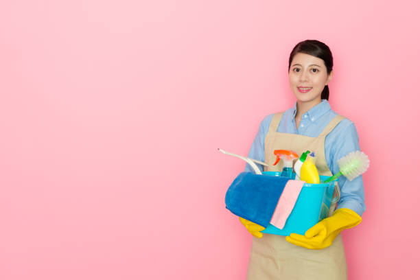 istock pretty housekeeper woman holding cleaning tool 1014676146