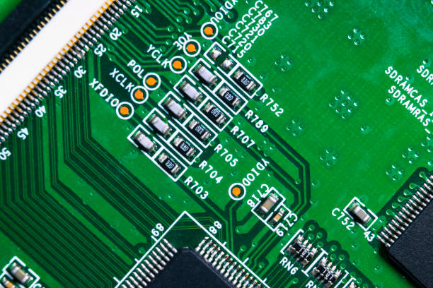 istock Macro shot of a Circuitboard with resistors microchips and electronic components. Computer hardware technology. Integrated communication processor. Information engineering. Semiconductor. PCB. Closeup 1014676242