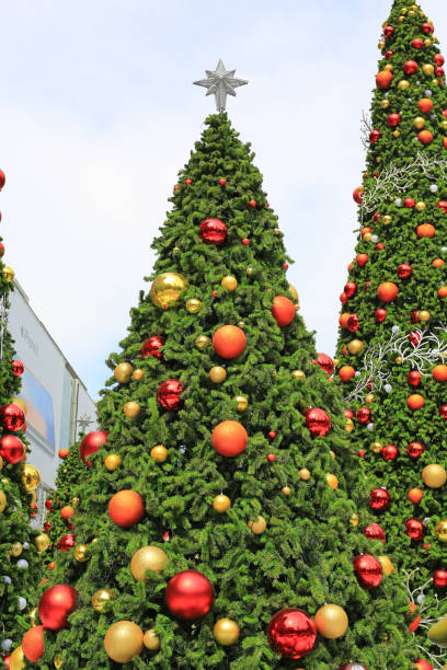 istock Christmas tree and bauble hanging decorations. 1014676940