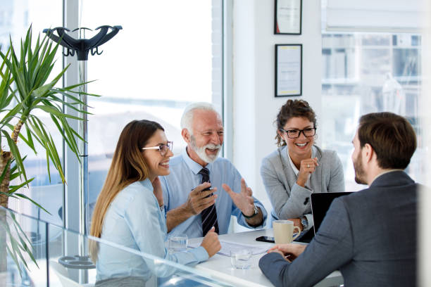 istock Business people having board meeting in modern office 1014680928