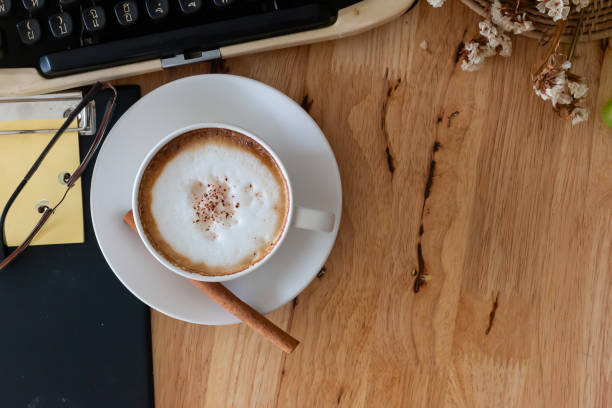 hot coffee in cup and coffee bean hot coffee in cup and coffee bean On the wooden table seramic stock pictures, royalty-free photos & images