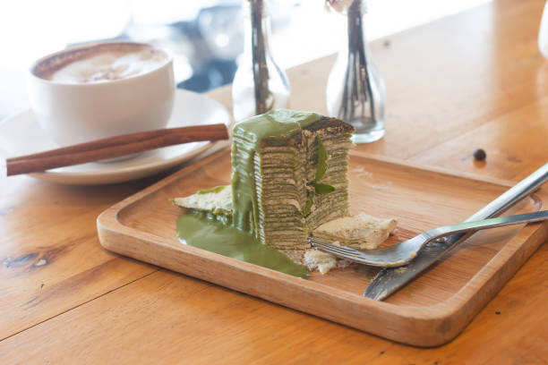 Cake and hot coffee Cake and hot coffee in cup on the wooden table seramic stock pictures, royalty-free photos & images