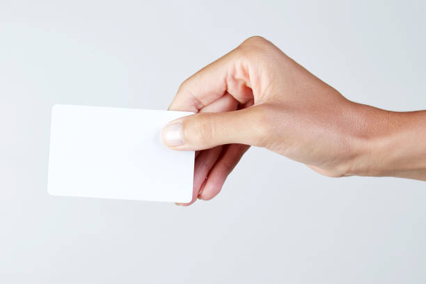 istock Young woman holding empty card 1014687648