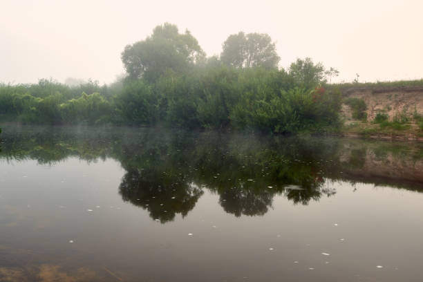 istock Fog over the river early in the morning. 1014693224