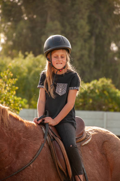 istock happy girl on horse back 1014694840