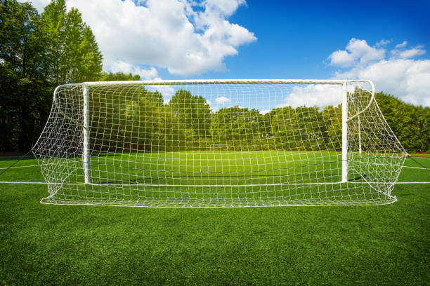 istock Soccer gates on the empty recreational stadium 1014697424