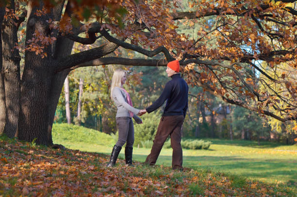 istock Couple relaxing in the park 1014697662