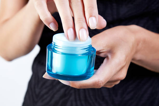 woman applying cream
