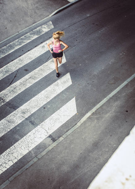 istock Female Athlete Running in Urban Environment 1014704164