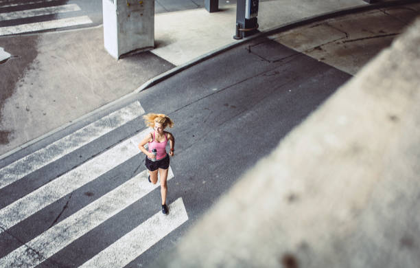istock Female Athlete Running in Urban Environment 1014704232