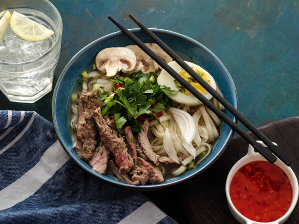 istock Asian ramen soup with beef, egg, chives and mushrooms in bowl. 1014709678